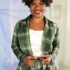 Straight size black model with short curly hair wearing green plaid suit and cream satin camisole, ethically handmade in NYC