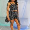 Black straight size model with locs modeling black and white striped crop top, shorts, and over skirt - ethically made in NYC